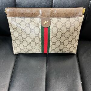 Gucci Plus Monogram Canvas Clutch with Web Stripe. No callouts